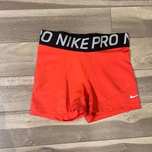 Peach Nike Pro 3”. Size: M. Gently used. No holes or stains.